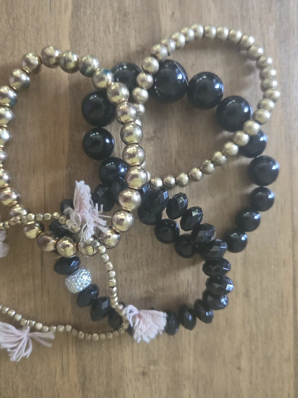 Gold and Black Beaded Stretch Bracelet Stack with Tassel Accents